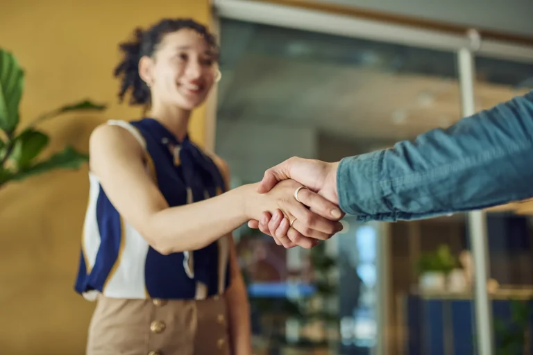 A young women shaking hands with a solicitor